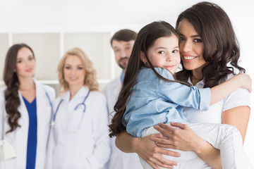 Fototapeta premium Mother and daughter in medical clinic