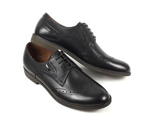 Classic black leather mens shoes with laces isolated on white background top view