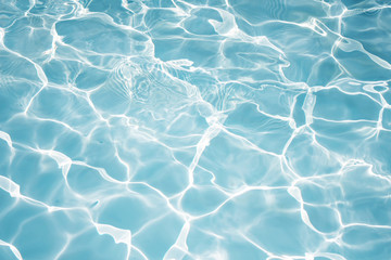 Texture of water in swimming pool for background