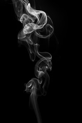 Movement of white smoke on black background