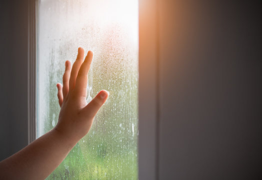 Hand Child With Fogged On The Window.