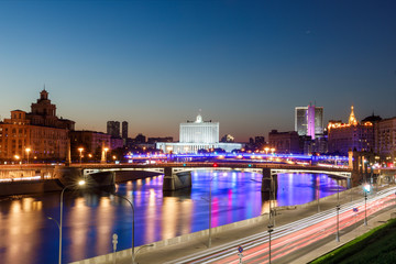 Fototapeta na wymiar House of the government of the Russian Federation, beautiful Moscow river, night road and water traffic along the river and the embankment