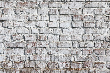 Old wall made of red brick, painted white in loft style for modern designer interior of room, bar or restaurant