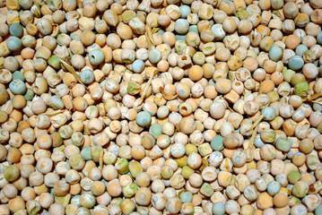 Dry peas of different soft colors, organic food background, soft bokeh backdrop