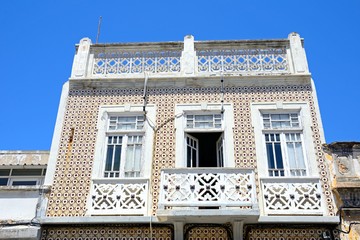 Traditional Portuguese building in the old town with tiled walls, Olhau, Portugal.