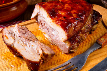 spicy roasted meat with mushroom sauce in the oven