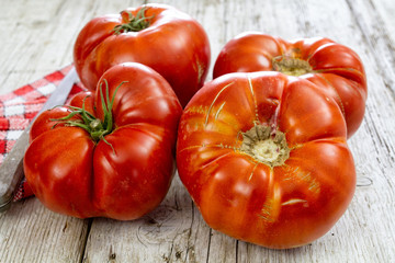 fresh tomatoes on wood