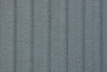 gray stone background on a concrete wall with stripes