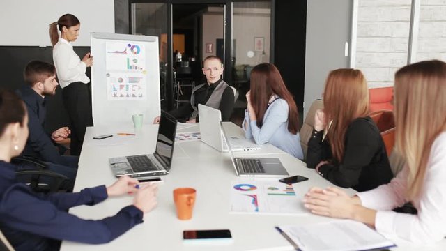woman making presentation about new idea in modern office