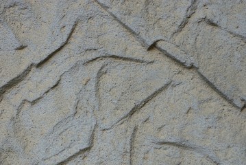 Fototapeta na wymiar Gray stone texture on a concrete wall with stripes