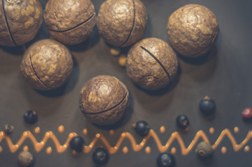 Fototapeta premium macadamia, Australian nut in a ceramic plate