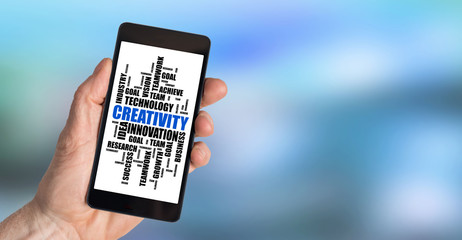 Creativity word cloud concept on a smartphone