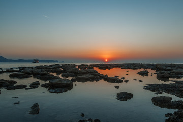 Fototapeta na wymiar Bright beautiful scenery, sunset by the sea, dawn and sea tide, Rhodes, Greece