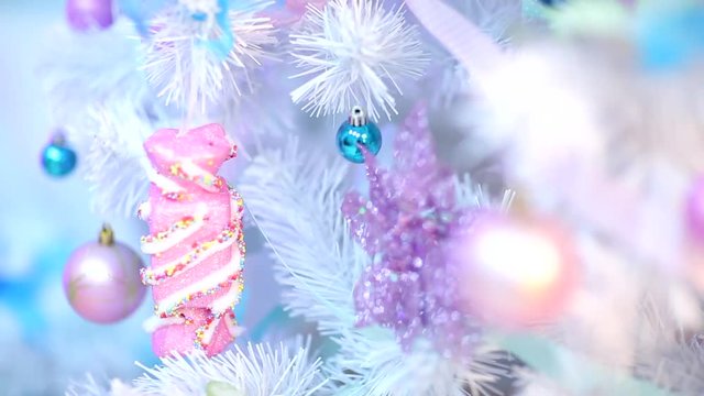 beautifully decorated Christmas tree for Christmas in pink and blue tones
