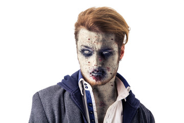 Male zombie standing on white background, with white eyes, looking at camera, isolated