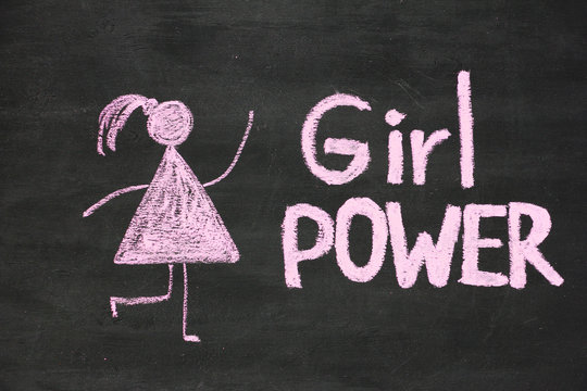 Inscription Girl Power and woman drawing symbol on chalkboard or blackboard. Lettering text sign. Feminism concept