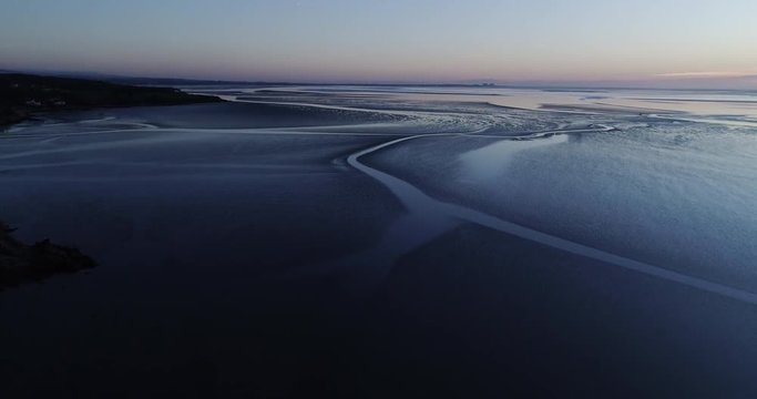 Sunset over Morecambe bay at low tide.