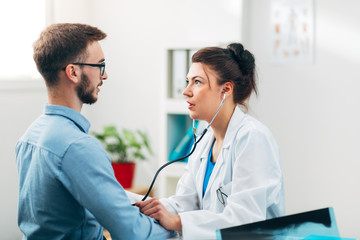 Woman Doctor Performing Stethoscope Check Up