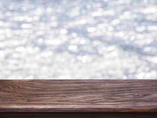 Wood table top on bokeh light gray background. For montage product display or design key visual layout