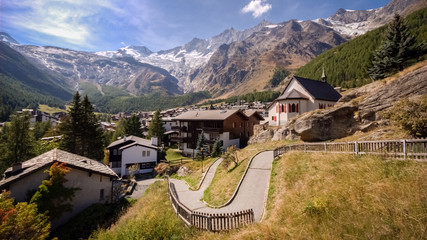 On a late september day the sun is shining on Saas-Fee, the main village in the Saastal, or the Saas Valley, and is a municipality in the district of Visp in the canton of Valais in Switzerland.