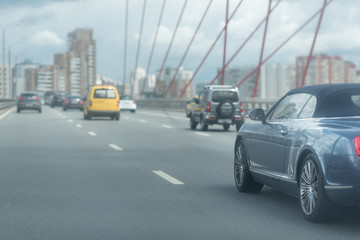 Car driving on freeway at the bridge