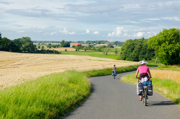 Groupp of  cycle tourist on the scenic countryside road in Denmark - island Mon. - obrazy, fototapety, plakaty
