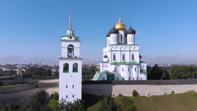 Trinity Cathedral, Kremlin in Pskov, Russia, Europe. Aerial view of Pskov Kremlin and Trinity Cathedral church in russian city. Panorama of city, cityscape. Embankment of Velikaya river. Famous place