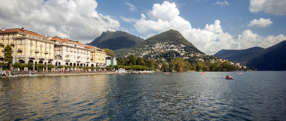 Fototapeta na wymiar When taking a boat from Lugano to Gandria on the Lake Lugano you can enjoy gorgeous views on the city of Lugano in the canton of Ticino (Switzerland)
