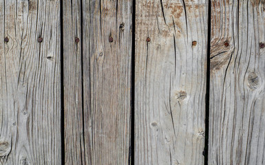 Old boards, a fence fastened with nails