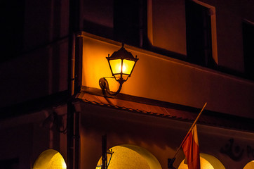 old street lamp on the wall of the house