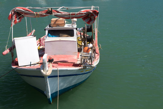 Traditional greek fishing boat on the harbor