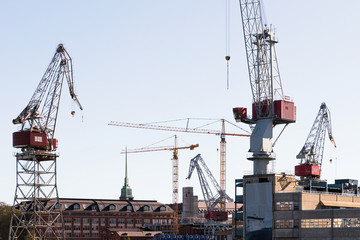 Fototapeta na wymiar Cranes in the sea freight port in Helsinki