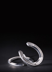 Polished Aluminum Horseshoe on black background
