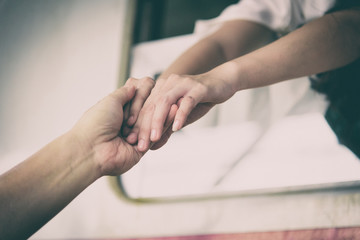 Asian woman traveler has leaving from her boyfriend on the train at Hua Lamphong station at Bangkok, Thailand.