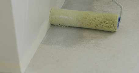 closeup applying primer on the floor