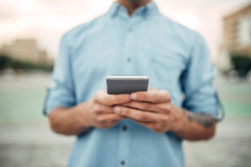 Phone addiction, addict male person using gadget