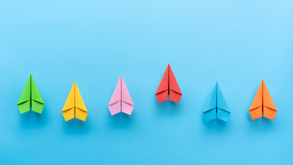 Paper planes on blue background, Business competition concept.
