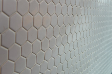 A simple white texture pattern of hexagons as a background