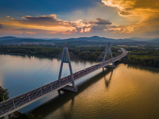 Budapest, Hungary - Megyeri Bridge over River Danube at sunset with beautiful blue & orange sky