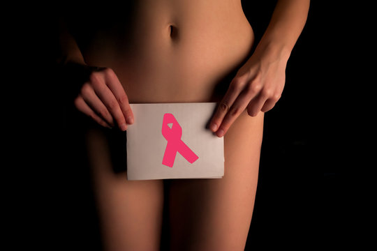 naked woman shows pink cancer awarness symbol