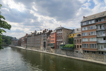 Fototapeta na wymiar The waterfront of Namur on the river Meuse, view from a bridge