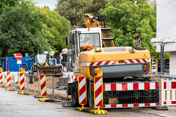 The excavator works on road repair