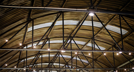 Metal net lamp hanging under zinc roof