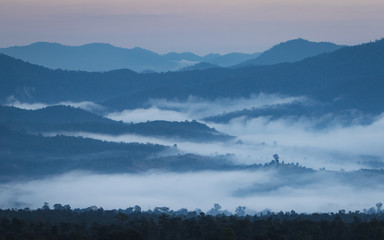 Sunrise in Northern Thailand with a misty landscape and hills