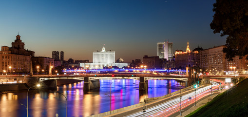Fototapeta premium House of the government of the Russian Federation, beautiful Moscow river, night road and water traffic along the river and the embankment