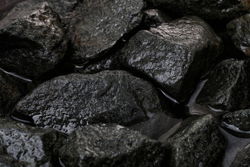 Rough wet granite stones