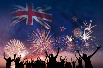 Fototapeta na wymiar People are looking on fireworks and flag of New Zealand