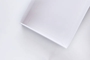 Top view of white empty open gift box on white background, holiday and event concept. Copy space for text