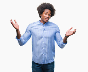 Afro american man over isolated background clueless and confused expression with arms and hands raised. Doubt concept.