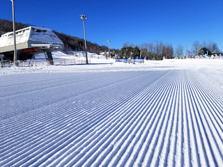 Groomed snow of alpine skiing trails